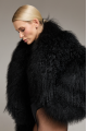 Women's short black fur coat made of natural llama fur